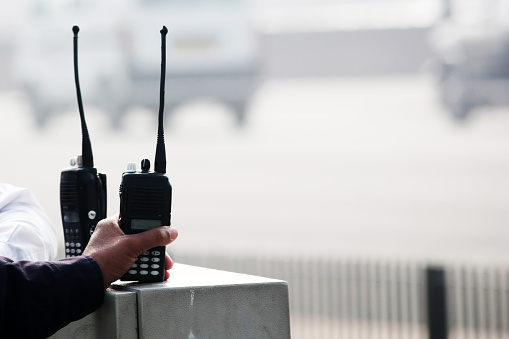 Security Man holding Walkie-talkie